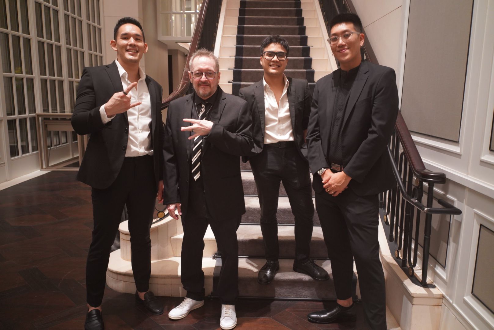 The Jukuleles in suits before a wedding performance