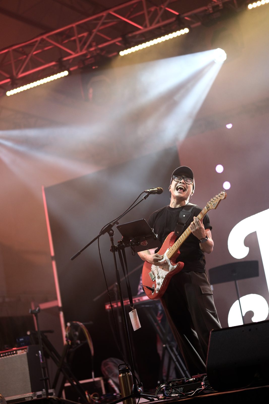 Wan on guitar at a festival show