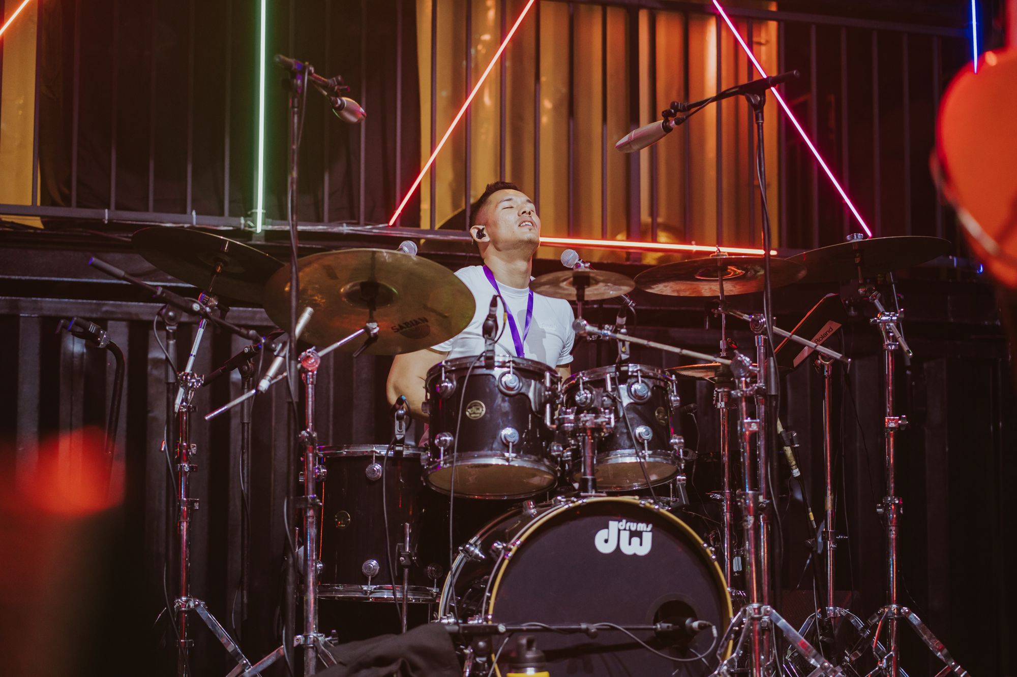 Zi on drums with The Jukuleles live band