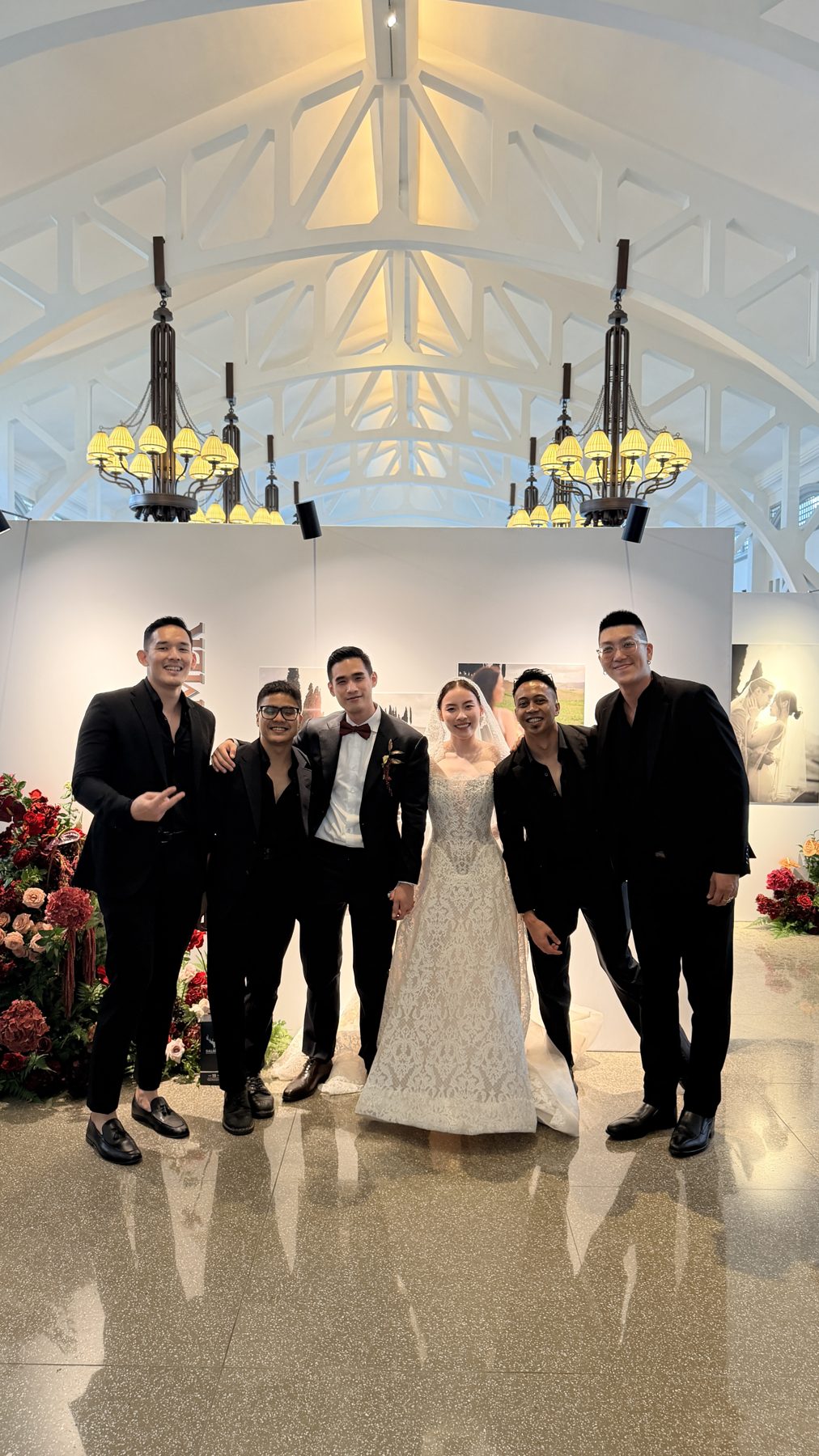 Wedding live band The Jukuleles with newlyweds at a Singapore wedding venue